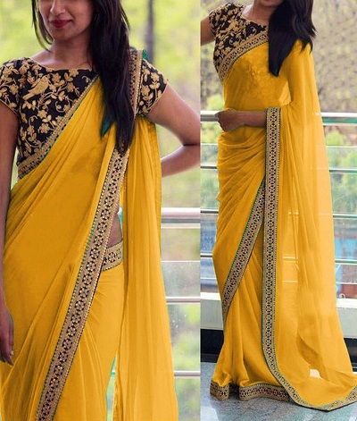 Yellow simple saree with heavy navy blouse
