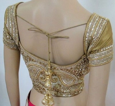 Golden silk blouse with heavy embellishment and stone workGolden silk blouse with heavy embellishment and stone work