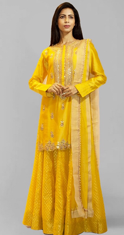 Party wear yellow silk kurta with brocade skirt
