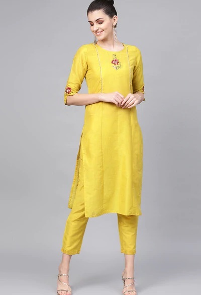 Yellow medium length panelled kurti with pencil trouser pants