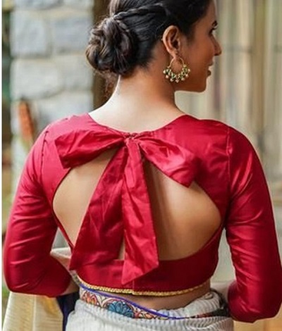 Backless blouse with bow shaped pattern