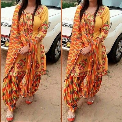 Cotton embroidered orange suit with orange Phulkari dupatta