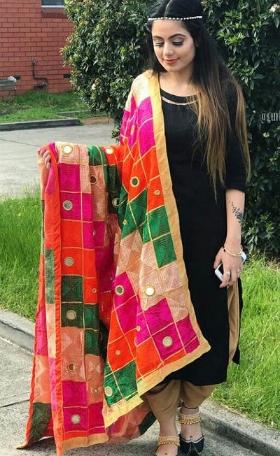 Multicolor Phulkari Dupatta with black kameez and Golden salwar