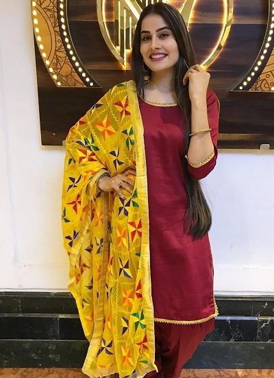 Simple Maroon art Silk suit with yellow Phulkari dupatta