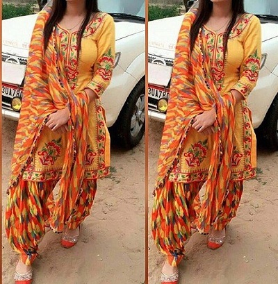 Stylish Orange embroidered suit with Phulkari salwar and dupatta