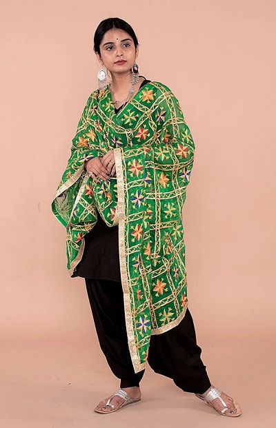 Very heavy green Phulkari Dupatta with simple plain black salwar suit