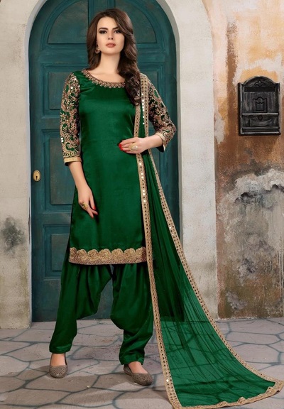 Dark green heavy embroidered party wear green salwar kameez