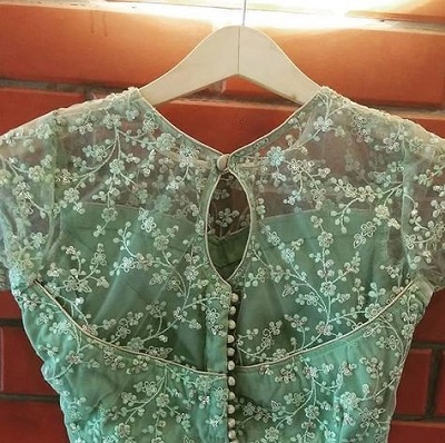 Thread work net mint green blouse design