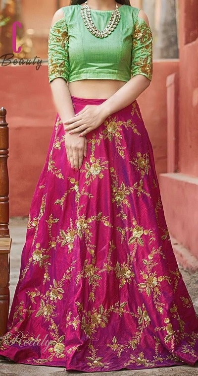 Green crop top with embroidered pink lehenga