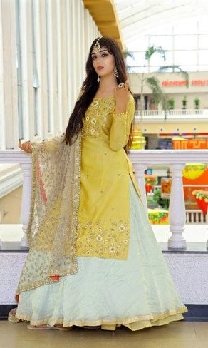 Stylish yellow long kurta with white lehenga skirt and dupatta