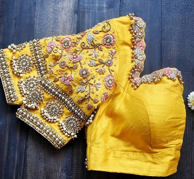 Yellow heavy embroidered stone work blouse for wedding