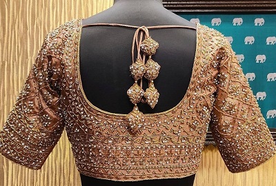 Golden color bridal heavy aari maggam work blouse pattern