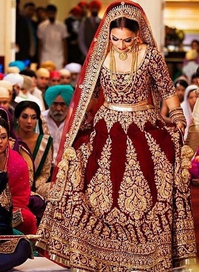 Maroon heavy embroidered lehenga house for Punjabi bride