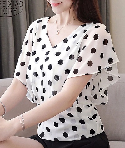 Polka dotted black and white chiffon top with flutter sleeves