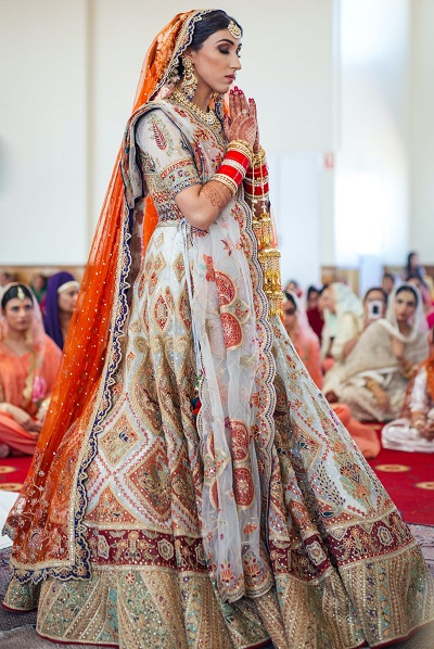 White and red gorgeous Punjabi style bridal dress