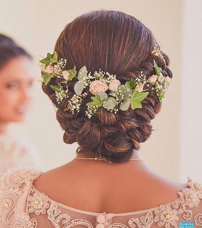 Dutch braided bun with floral hair jewelery