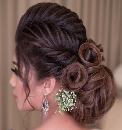 French roll inspired low bun hairstyle for lehenga