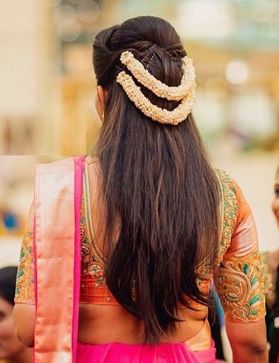 Half updo hairstyle with Gajra strands