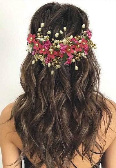 Messy half updo with floral jewelery hairstyle
