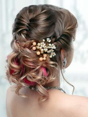 Rose ringlet inspired low hanging bun hairstyle