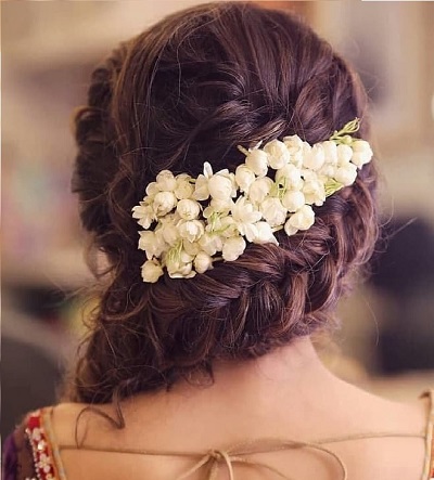 Side dutch braid hairstyle for lehenga with mogra flower clip