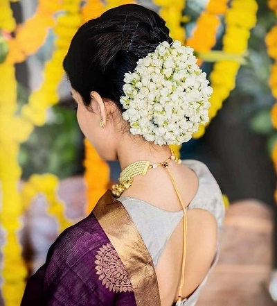 Simple bun with lots of Mogra flowers for Reception