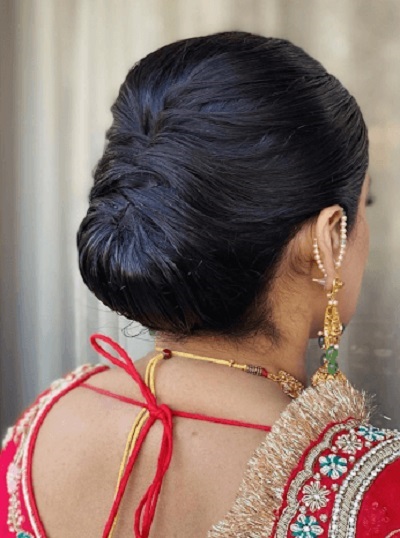 Simple hidden sleek bun hairstyle for Wedding Sarees
