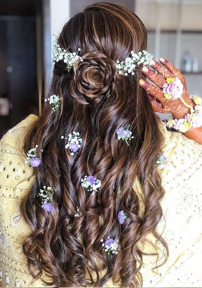 Stylish curly half updo with floral clips
