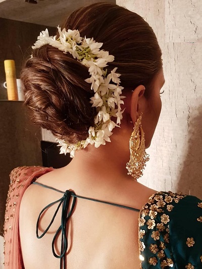 Twisted rope bun with Gajra hairstyle for lehenga