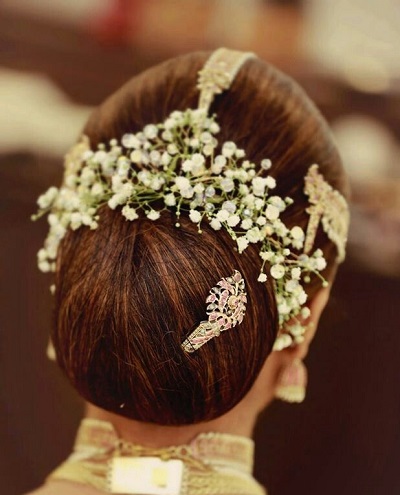 White gajra and hair jewelery pinned hairstyle