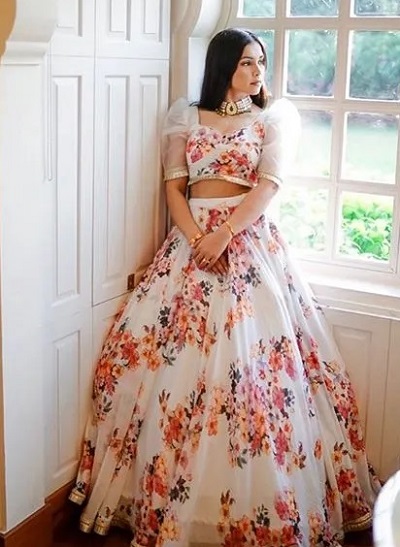 Net blouse with full flared floral print lehenga