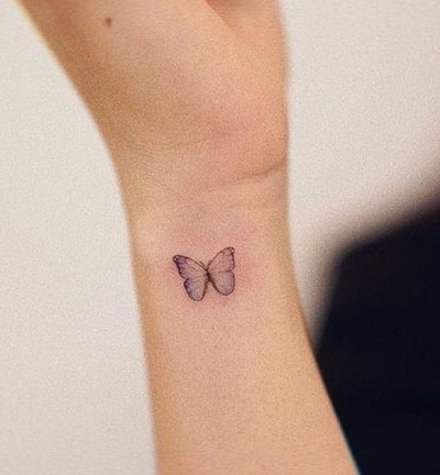 Butterfly side wrist tattoo 
