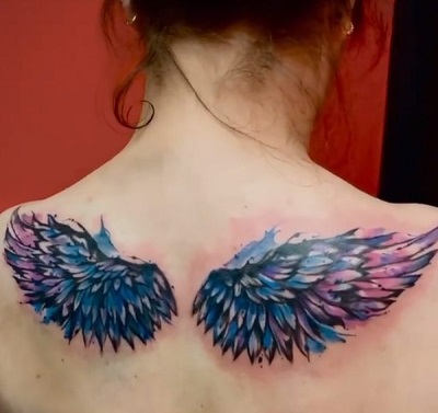 Colored Upper Back Angel Wing Tattoo