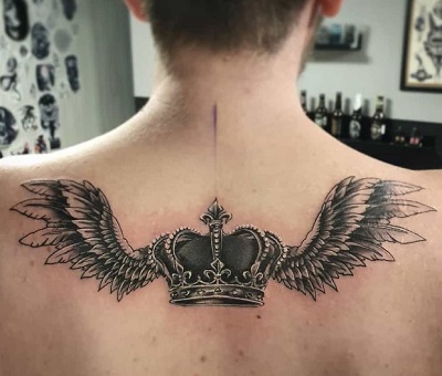 Crown With Feather Tattoo