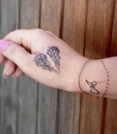 Hand Angel Wing Tattoo
