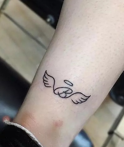 Very simple small Angel wing ankle tattoo