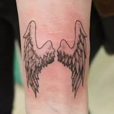 Small Wrist Angel Wing Tattoo Design