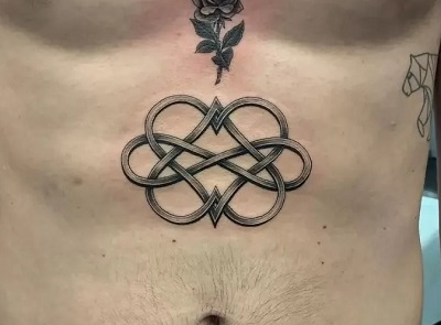 Abdomen Celtic symbol tattoo
