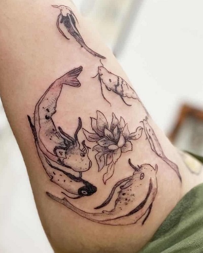 Upper Arm Multiple Koi Fishes Tattoo