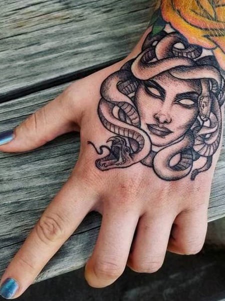 Back of the hand medusa tattoo