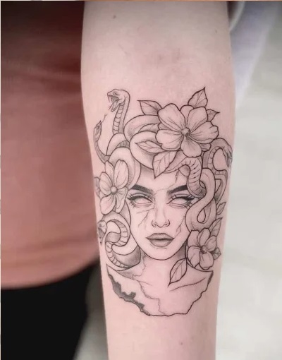Forearm floral medusoid tattoo