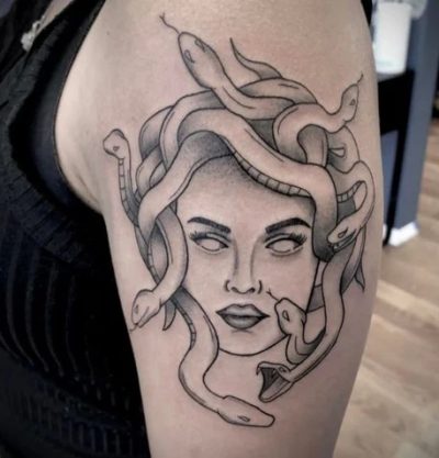 Upper arm Medusa tattoo