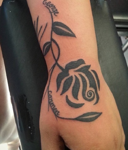 Filled In Rose Shaped Tattoo