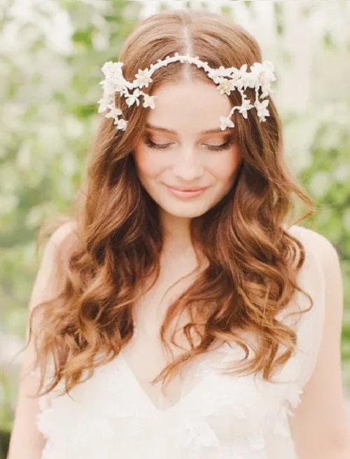 Loose curled hair with floral accessories
