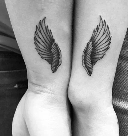 Paired winged tattoos