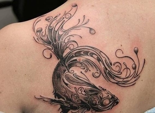 Women Fish Tattoo At Back