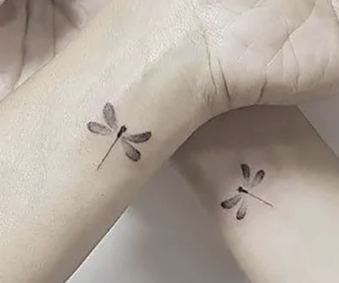 Delicate Small Firefly Tattoo