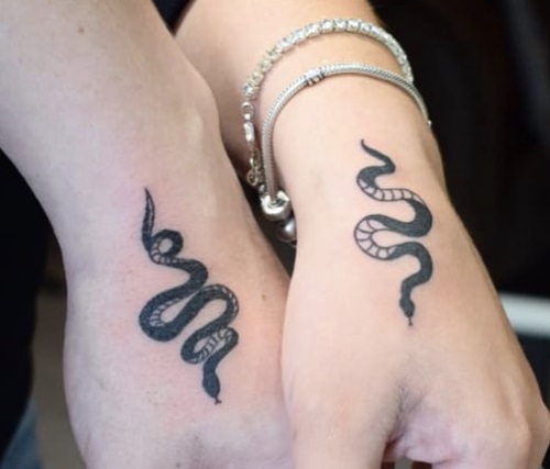 Matching Snake Hand Tattoos