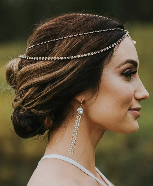 Sleek Low Updo For Wedding With Jewelery