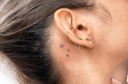 Stardust Behind The Ear Tattoo Design